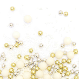 Décor à parsemer : mélange de décors sucrés blancs, dorés et argentés