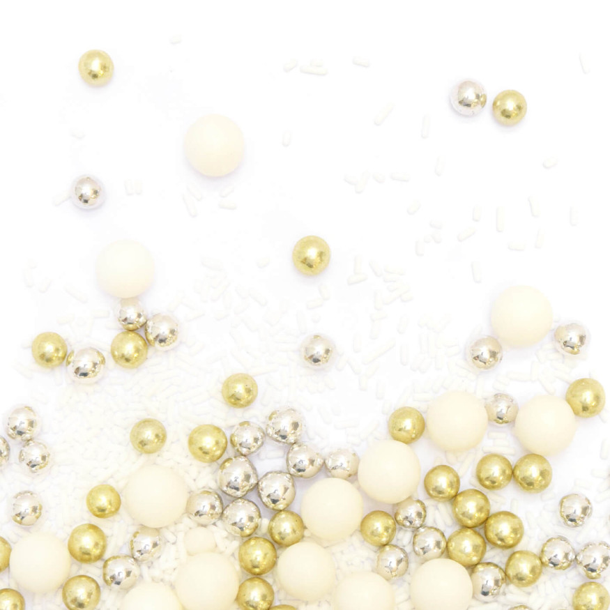 Décor à parsemer : mélange de décors sucrés blancs, dorés et argentés